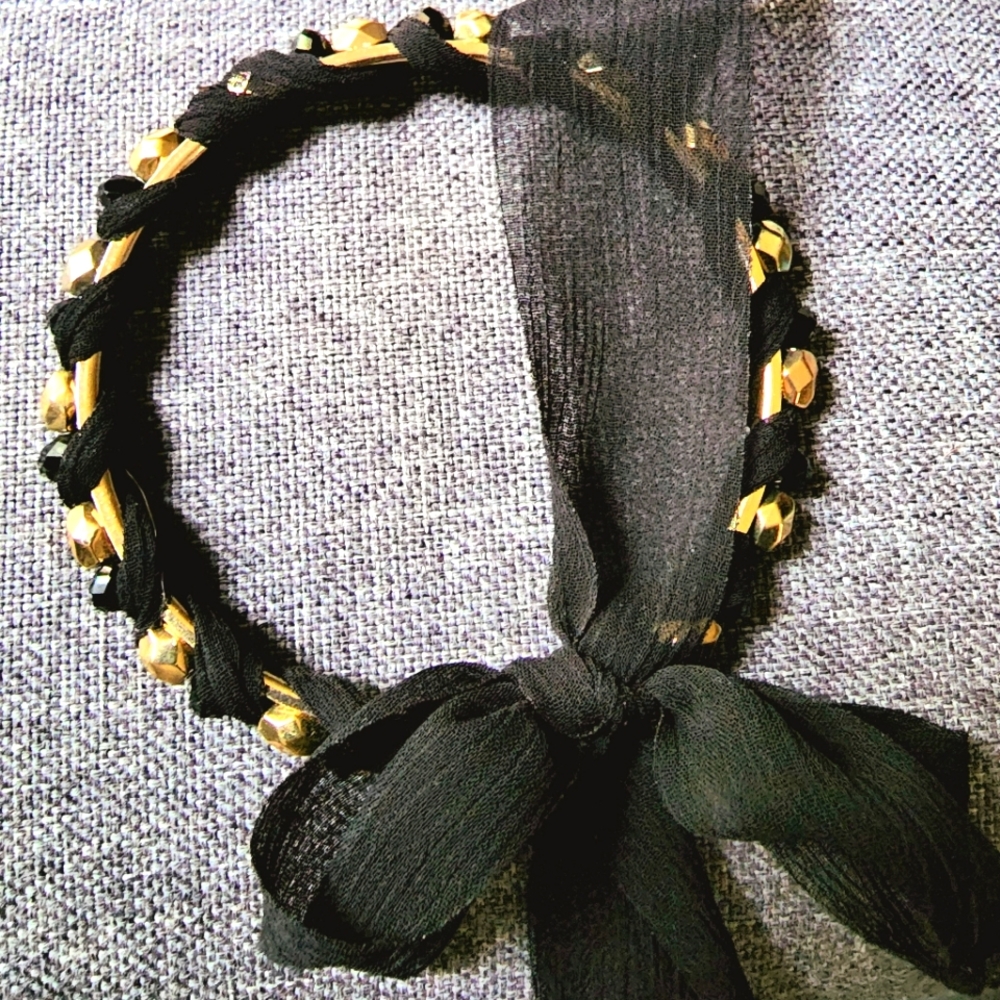 Gold faceted beaded station bracelet with black sheer bow